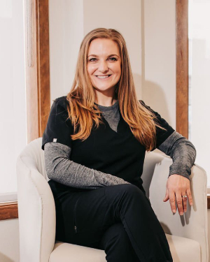 a person sitting next to a window